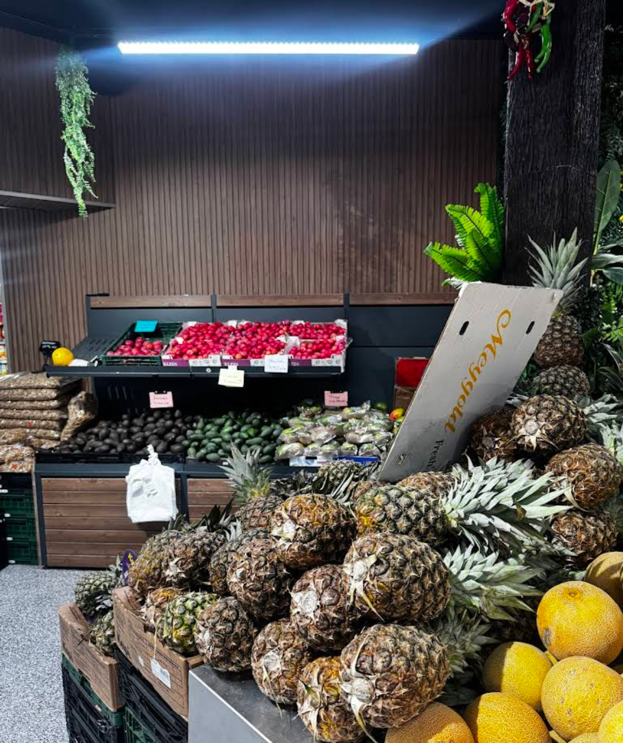 Fruit display with pineapples, avocados and citrus at Yaşar Market